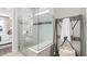 Modern shower with glass enclosure and built-in bench at 2749 Serenity Meadow Dr, Kissimmee, FL 34744
