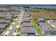Aerial view of homes in the community and a lake in the distance at 3182 Sailing Pier Ave, Winter Garden, FL 34787