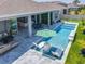 Aerial view of the backyard with a pool, patio, and outdoor furniture at 3182 Sailing Pier Ave, Winter Garden, FL 34787