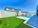 Spacious backyard with a mini golf course and a stunning pool, ideal for outdoor entertainment and relaxation at 3182 Sailing Pier Ave, Winter Garden, FL 34787