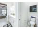 Bathroom with a toilet and vanity that is open to a spacious walk-in closet at 3182 Sailing Pier Ave, Winter Garden, FL 34787