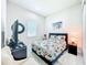 Cozy bedroom featuring a floral-patterned bed, modern furnishings, and soft lighting at 3182 Sailing Pier Ave, Winter Garden, FL 34787