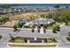 Aerial view of a community center with a pool, playground, and parking lot at 3182 Sailing Pier Ave, Winter Garden, FL 34787