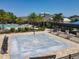 Community pool with palm trees, lounge chairs, and a splash pad at 3182 Sailing Pier Ave, Winter Garden, FL 34787