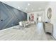 Dining room with a modern accent wall, marble-look table, and a view of the foyer at 3182 Sailing Pier Ave, Winter Garden, FL 34787