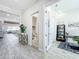 Bright hallway featuring tiled floors, neutral walls, and access to multiple rooms at 3182 Sailing Pier Ave, Winter Garden, FL 34787