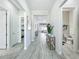Open hallway with access to bedrooms, bathrooms, living area, and view to the home office at 3182 Sailing Pier Ave, Winter Garden, FL 34787