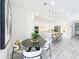 Eat-in kitchen area features a modern island with seating, stainless appliances, and an open floor plan at 3182 Sailing Pier Ave, Winter Garden, FL 34787