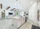 Spacious kitchen with central island, stainless appliances, and open floor plan to living area at 3182 Sailing Pier Ave, Winter Garden, FL 34787