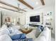 Comfortable living room with built-in shelving, a decorative fireplace, and a large sectional sofa at 3182 Sailing Pier Ave, Winter Garden, FL 34787