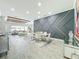 Open-concept living and dining area with stylish decor, ample lighting, and views of the backyard at 3182 Sailing Pier Ave, Winter Garden, FL 34787