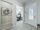 Welcoming entryway with decorative glass door leading to a bright home office at 3182 Sailing Pier Ave, Winter Garden, FL 34787