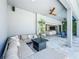 Comfortable outdoor living area with a large sectional couch and sliding doors to the interior at 3182 Sailing Pier Ave, Winter Garden, FL 34787