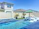 Backyard pool with sun loungers and waterfall feature for a relaxing outdoor experience at 3182 Sailing Pier Ave, Winter Garden, FL 34787