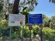 Informational signs highlighting Scrub Point Preserve's conservation efforts and recreational opportunities at 3182 Sailing Pier Ave, Winter Garden, FL 34787