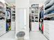 Spacious walk-in closet with custom shelving and ample storage for clothing and accessories at 3182 Sailing Pier Ave, Winter Garden, FL 34787