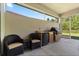 Outdoor patio with a built-in outdoor kitchen and seating area at 3375 Bellino Blvd., New Smyrna Beach, FL 32168