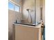 A tiled shower with a glass enclosure and a modern showerhead offers a spa-like experience at 3375 Bellino Blvd., New Smyrna Beach, FL 32168