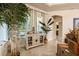 Bright sitting area with decorative console table, indoor plants, and neutral tones at 3375 Bellino Blvd., New Smyrna Beach, FL 32168