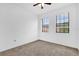 Neutral bedroom with carpeted floors and two windows allowing natural light at 3462 Allegra Cir, St Cloud, FL 34772