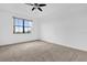 Spacious bedroom featuring a ceiling fan, neutral carpet, and a bright window at 3462 Allegra Cir, St Cloud, FL 34772