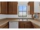 Kitchen features a stainless steel sink, and white dishwasher at 3462 Allegra Cir, St Cloud, FL 34772