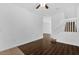 View of the living room with hardwood floors and stairs to the second level at 3462 Allegra Cir, St Cloud, FL 34772