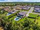 A sweeping aerial view showcases the property's pool, lush landscaping, and spacious surroundings at 3664 Farm Bell Pl, Lake Mary, FL 32746