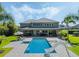 A large in-ground swimming pool and spa is the focal point of the backyard patio of this luxury property at 3664 Farm Bell Pl, Lake Mary, FL 32746
