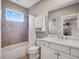Cozy bathroom featuring a tub/shower, vanity with countertop space, and neutral wall colors at 3664 Farm Bell Pl, Lake Mary, FL 32746