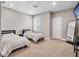 Spacious bedroom with twin beds, neutral decor, and a ceiling fan for added comfort at 3664 Farm Bell Pl, Lake Mary, FL 32746