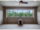 Bonus room featuring large windows with backyard views and a dog house at 3664 Farm Bell Pl, Lake Mary, FL 32746