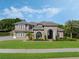 Beautiful home exterior with lush green lawn, well-maintained landscaping, and architectural details at 3664 Farm Bell Pl, Lake Mary, FL 32746