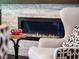 Modern fireplace with stone surround and comfortable seating for a cozy atmosphere at 3664 Farm Bell Pl, Lake Mary, FL 32746