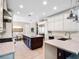 Spacious kitchen with island, bar seating, and stainless steel appliances for cooking at 3664 Farm Bell Pl, Lake Mary, FL 32746
