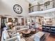 Spacious living room with high ceilings and open layout to kitchen and staircase at 3664 Farm Bell Pl, Lake Mary, FL 32746