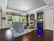 Beautiful living room with dark wood floors, a chandelier, and a bar with a wine fridge at 3664 Farm Bell Pl, Lake Mary, FL 32746