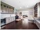 Entertainment area complete with custom cabinetry, a wet bar, and a view into the adjacent Gathering room at 3664 Farm Bell Pl, Lake Mary, FL 32746