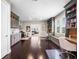 Open living space featuring custom cabinetry, a wet bar, and dual built-in office workspaces at 3664 Farm Bell Pl, Lake Mary, FL 32746