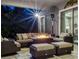 Cozy outdoor living space with comfortable seating and a warm fire pit under covered patio at 3664 Farm Bell Pl, Lake Mary, FL 32746