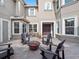 An outdoor patio with brick pavers featuring outdoor furniture, seating and a fire pit for enjoying the backyard at 3664 Farm Bell Pl, Lake Mary, FL 32746