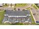Aerial view of condos showcasing private screened pools, ample parking, and lush landscaping at 368 Ocean Course Ave, Davenport, FL 33896