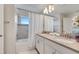 Bright bathroom featuring a dual vanity, bathtub, and a shower, providing a functional space at 368 Ocean Course Ave, Davenport, FL 33896