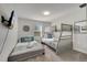 Comfortable bedroom with twin bed, bunk bed, and coastal-themed decor at 368 Ocean Course Ave, Davenport, FL 33896