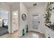 Inviting foyer with tile flooring, white door and view to bathroom and bedroom at 368 Ocean Course Ave, Davenport, FL 33896