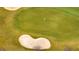 An overhead view of the community golf course with well manicured green at 368 Ocean Course Ave, Davenport, FL 33896