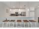 Kitchen features a long island, stainless steel appliances, and open layout for easy entertaining at 368 Ocean Course Ave, Davenport, FL 33896