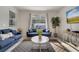 Inviting living room with stylish decor, comfortable seating, and access to the outdoor area at 368 Ocean Course Ave, Davenport, FL 33896