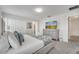 Comfortable bedroom with soft carpeting, a television, and an en-suite bathroom for added convenience at 368 Ocean Course Ave, Davenport, FL 33896
