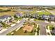 Overhead view of a modern playground with swings and slide for the community at 368 Ocean Course Ave, Davenport, FL 33896